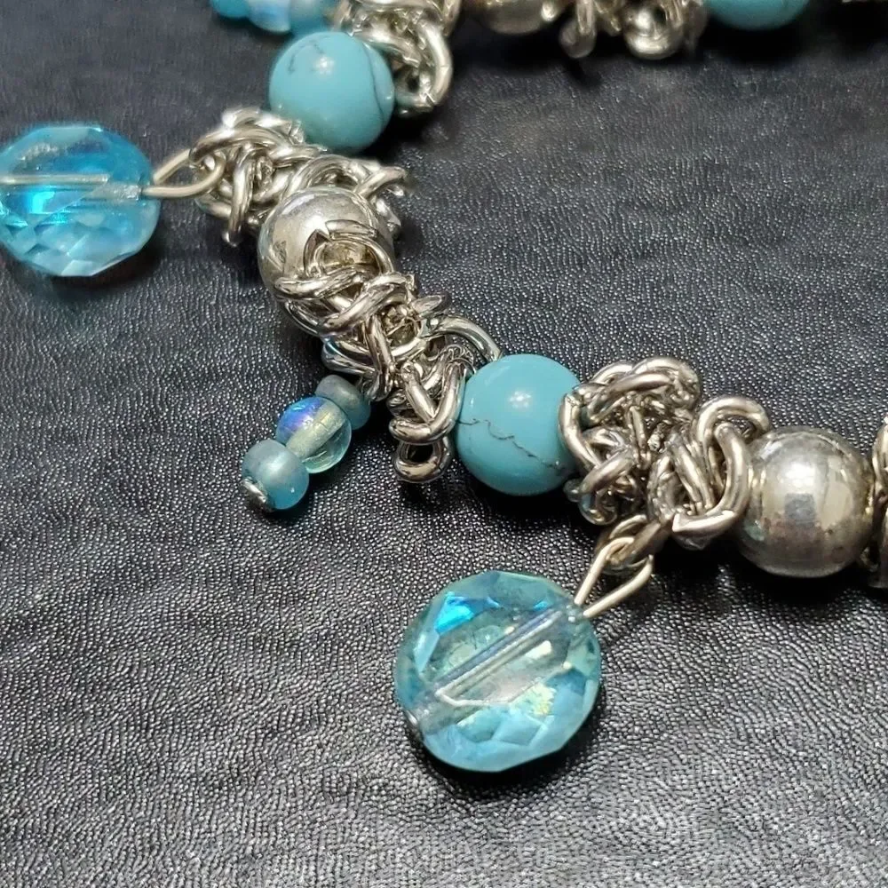 Child's silver tone blue bead bracelet 6